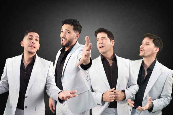 Our four male acapella singers for parties wearing white formal suits and black under shirts while passionately singing together | Altus Entertainment